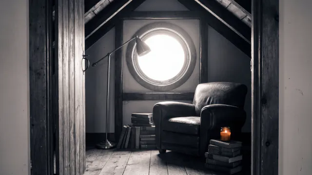 A small attic reading room with a round window, a worn leather armchair, a floor lamp and stacked books, seen from the doorway, bright midday sun through the window, lamp off, 35mm, photographic realism