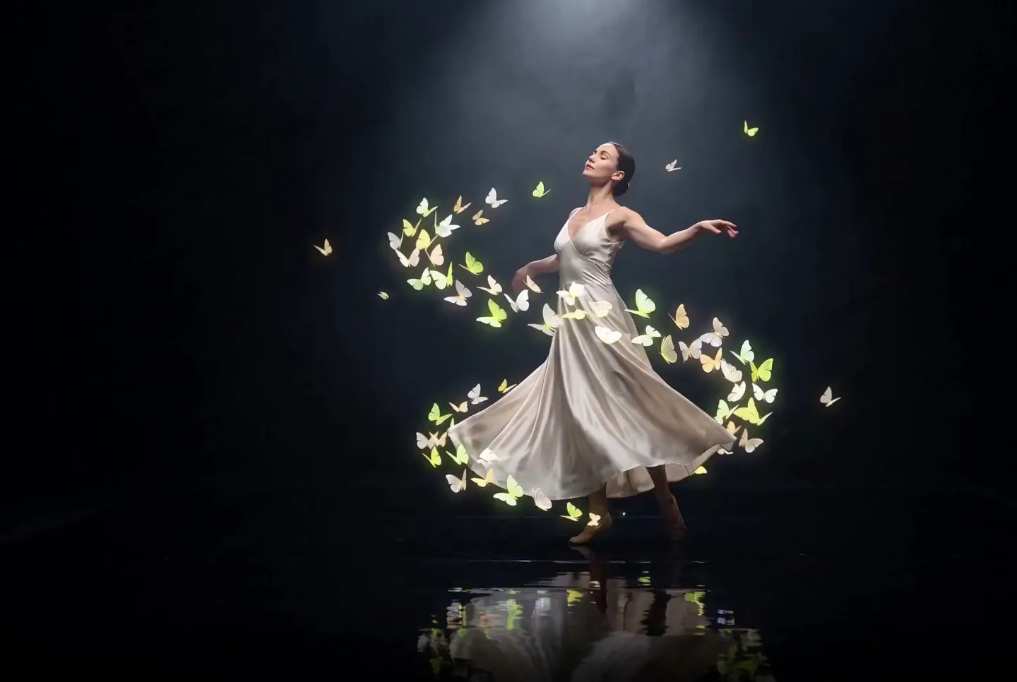 A dancer in a white gown surrounded by glowing butterflies.